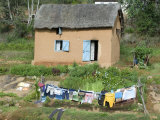 Clothes Drying on a Clothesline in Front of a House, Madagascar Photographic Print