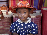 Young Girl Beside a Road-Side Stall Near Antananarivo, Capital of Madagascar Fotografisk tryk af Nigel Pavitt Young Girl Beside a Road-Side Stall Near Antananarivo, Capital of Madagascar Fotografisk tryk af Nigel Pavitt