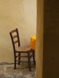 Sardinia, North Western Sardinia, Castelsardo, Cafe Chair, Italy Photographic Print by Walter Bibikow