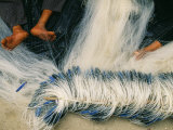 Detail of Feet Being Used to Repair Fishing Nets, Vietnam Photographic Print by Paul Harris