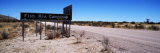 Road Sign at Roadside, Fish River Canyon, Namibia Lámina fotográfica por Panoramic Images