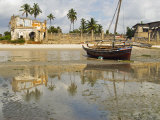 East Africa, Tanzania, Zanzibar, A Boat Moored on the Sands of Bagamoyo Photographic Print by Paul Harris