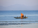 Tthe Crew of Small Fishing Boat Hurries Home to Sittwe Harbour with their Catch, Burma, Myanmar Photographic Print by Nigel Pavitt