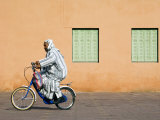 Man with Bicycle Infront of Red Rose Walls and Minaret Photographic Print by Christian Kober