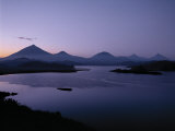 Most Beautiful Lake Mutanda of Great Lakes Region with Volcanoes of Virunga Chain Behind, Uganda Lámina fotográfica por Nigel Pavitt