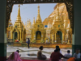 Burma, Yangon, Devout Buddhists Pray at the Shwedagon Golden Temple, Myanmar Photographic Print by Nigel Pavitt