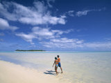 Couple on a Beach, Aitutaki, Cook Islands Photographic Print by Neil Farrin