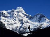 Trekker Crosses Bridge over Rio Frances with Summit of Paine Grande Behind Photographic Print by John Warburton-lee