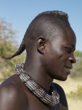 Himba Youth with His Hair Styled in a Long Plait, known as Ondatu, Namibia Photographic Print by Nigel Pavitt