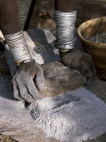 Nyagatom Woman Grinds Sorghum Using Two Stones, Omo River, South-Western Ethiopia Fotografie-Druck von John Warburton-lee