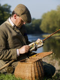 Wrexham, A Fisherman Selects a Fly While Salmon Fishing on the River Dee, Wales Photographic Print by John Warburton-lee