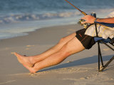 A Man Fishes from His Deck Chair in Platypus Bay on Fraser Island's West Coast, Australia Photographic Print by Andrew Watson