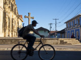 Granada, Man Riding Bike Past Iglesia De La Merced, Nicaragua Photographic Print by Jane Sweeney