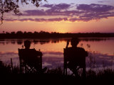 Sundowners at Tongabezi, Looking across the Zambezi River Photographic Print by John Warburton-lee