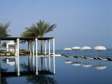 Reflections in the Still Water of the Infinity Pool at the Chedi Hotel Photographic Print by John Warburton-lee
