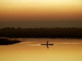 Fisherman at Sunset on the Chobe River, Botswana Photographic Print by Nigel Pavitt