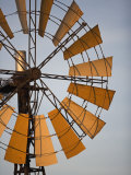 Erongo Region, Okahandja, the Fins of a Windmill Highlighted by the Setting Sun, Namibia Photographic Print by Mark Hannaford