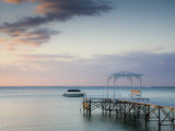 Western Mauritius, Le Morne Peninsula, Pier at the Dinarobin Hotel, Dusk, Mauritius Photographic Print by Walter Bibikow