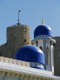 Ornate Domes and Minaret of the Khor Mosque Contrast with the Old Walls of Fort Mirani Photographic Print by John Warburton-lee