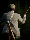 Trout Fisherman Casting to a Fish on the River Dee, Wrexham, Wales Photographic Print by John Warburton-lee