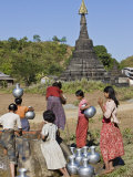 Against a Backdrop of Ancient Temples, Rakhine Women Draw Water from a Well at Mrauk U, Myanmar Photographic Print by Nigel Pavitt