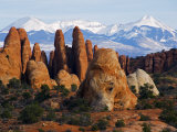 Utah, Mountains of Manti La Sal National Forest and Sandstone Pinnacles, Devils Garden Photographic Print by Christian Kober