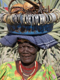 Himba Street Vendor at Opuwo Who Sells Himba Jewellery, Arts and Crafts to Passing Tourists Photographic Print by Nigel Pavitt