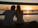 Queensland, Fraser Island, A Couple with Video Camera in Hand Watch Sunset from a Pier, Australia Photographic Print by Andrew Watson