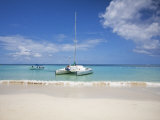 Bay Islands, Roatan, West Bay, Man Reading Book on Catamaran, Honduras Photographic Print by Jane Sweeney