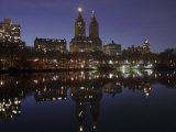 The San Remo Towers Skyline at Night Reflected in the Lake, Central Park, New York City Photographic Print by Wendy Connett