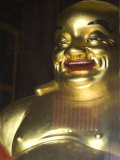 Large Golden Smiling Buddha in Kek Lok Si Buddhist Temple, Air Itam, Georgetown, Penang Photographic Print by Annie Owen