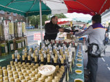 Olive Oil Stall at the Italian Market at Walton-On-Thames, Surrey Photographic Print by Hazel Stuart