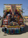 Man Fixing Decoration onto Truck for Diwali Celebrations, Pali District, Rajasthan, India, Asia Photographic Print by Annie Owen
