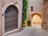 Narrow Street with Arches and Doorways in the Red Ochre Hilltop Town, Roussillon, Provence Photographic Print by Guy Edwardes