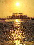 Sun over Ruin of West Pier, Brighton, Sussex, England Photographic Print by Neil Overy