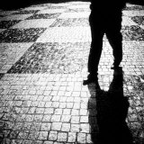 Silhouette of Mans Legs Walking on Cobblestone Street at Night Lámina fotográfica por Images Monsoon Silhouette of Mans Legs Walking on Cobblestone Street at Night Lámina fotográfica por Images Monsoon