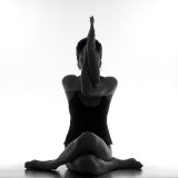 Woman Sitting with Legs and Arms Entwined Fotografie-Druck von Images Monsoon