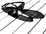 Black and White Image of Sunglasses and their Shadow on a Table Photographie par Images Monsoon
