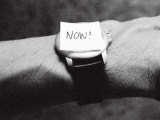 The Word Now as a Reminder Attached to a Watch on a Male Arm Reprodukcja zdjęcia autor Images Monsoon The Word Now as a Reminder Attached to a Watch on a Male Arm Reprodukcja zdjęcia autor Images Monsoon