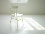 Lone White Chair in White Loft Space Photographic Print by Images Monsoon