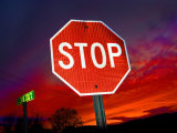 Stop Sign with an Intense Red Sunset in the Backround Photographic Print by John Churchman