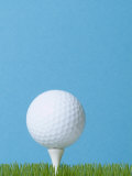 Golfball on Tee with Grass Photographic Print by EJ Carr