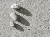 Three Pebbles on Granite Photographic Print by Kevin Walsh