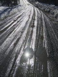 Muddy Wet Road Reflecting the Sunlight Photographic Print by John Churchman