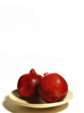 Two Pomegranates on Plate on White Background Photographic Print by Images Monsoon