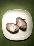 A Two One-Halfs of a Red Onion on a White Plate Photographic Print by Images Monsoon