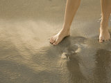 Girls Feet in Ocean, Top View Photographic Print by Images Monsoon