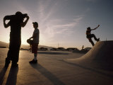 Teenagers Skateboard at a Park a Few Miles from a Chemical Test Site Photographic Print by Lynn Johnson