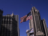 American Flag Near the Wrigley Building and Tribune Building Photographic Print by Paul Damien