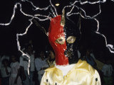 Man Celebrates Carnival by Wearing a Mask and Costume Photographie par David Evans
